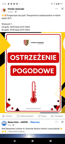 a thermometer is on a sign that says " ostrzezenie pogodowo "