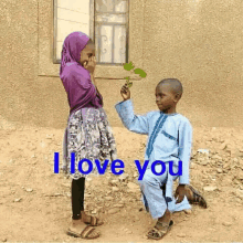 a boy is kneeling down to give a flower to a girl with the words " i love you " written on the bottom