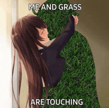 a girl is kissing a monster made of grass .