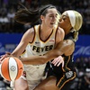 Connecticut Sun guard DiJonai Carrington (21) fouls Indiana Fever guard Caitlin Clark (22) during the third quarter of a WNBA basketball game, Tuesday, May 14, 2024, in Uncasville, Conn.