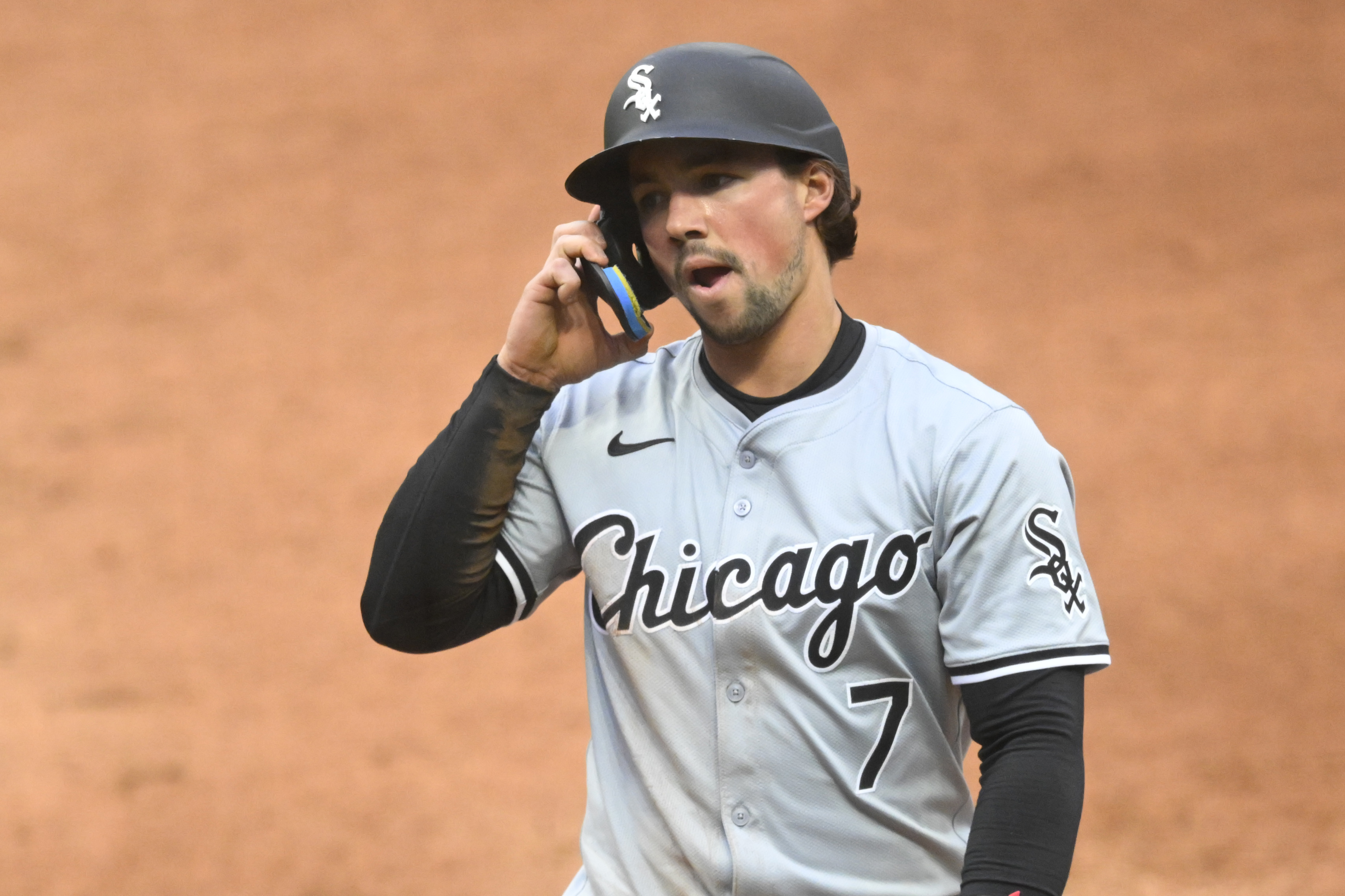 Apr 10, 2024; Cleveland, Ohio, USA; Chicago White Sox outfielder Dominic Fletcher (7) reacts after he was picked off first base in the second inning against the Cleveland Guardians at Progressive Field. Mandatory Credit: David Richard-USA TODAY Sports