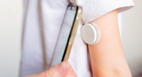 Smartphone reading glucose sensor on arm