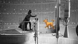 a statue of darth vader standing next to a dog