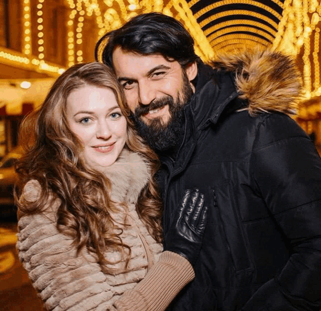 a man and a woman are posing for a picture