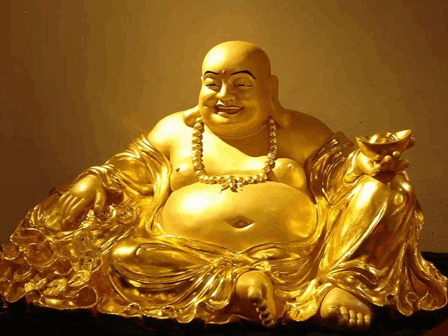 a gold statue of a laughing buddha with a pearl necklace on