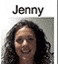 jenny is a woman with curly hair and glasses .