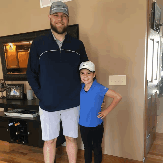 a man and a girl are posing for a picture