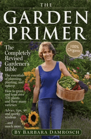 a garden primer book by barbara damrosch shows a woman holding a basket of plants