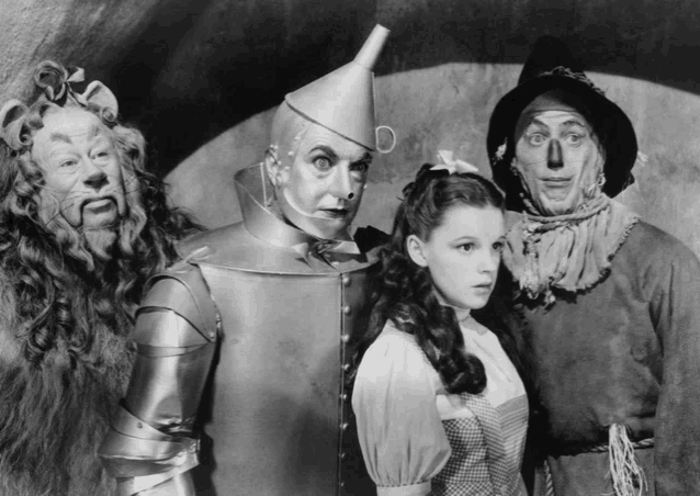 a black and white photo of the wizard of oz characters including the tin man