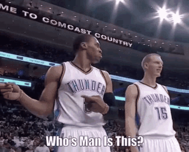 two thunder basketball players are standing in front of a sign that says comcast country