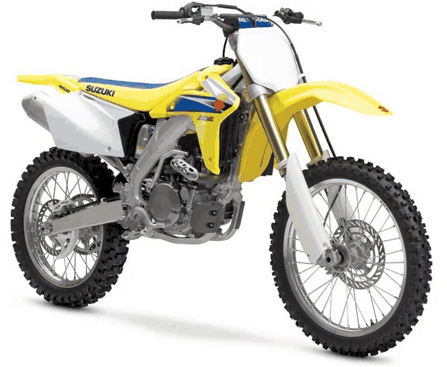 a yellow and blue suzuki dirt bike is shown