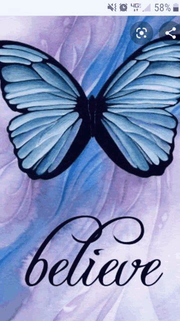 a phone screen shows a blue butterfly and the words believe