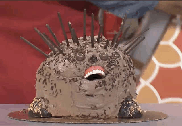 a cake that looks like a hedgehog with a mouth