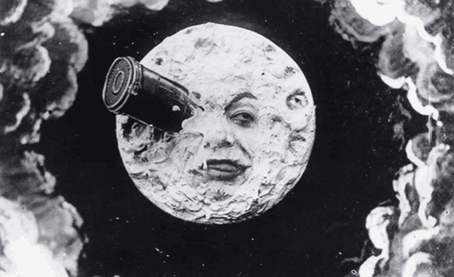 a black and white drawing of a face on the moon