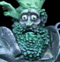 a statue of a green monster with a beard