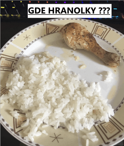 a plate of rice and chicken with the words gde hranolky