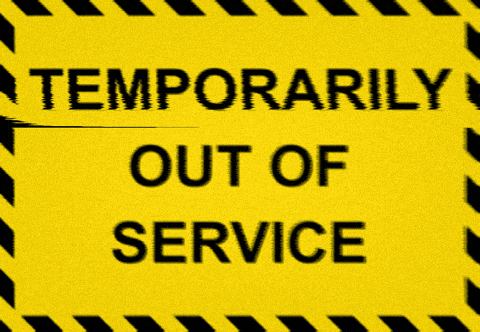 a yellow sign with black stripes says temporarily out of service