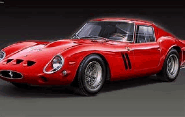 a red ferrari 250 gto is parked on a gray road .