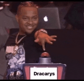 a man is pressing a button that says dracarys on it .