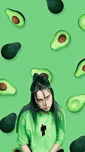 billie eilish is wearing a green shirt with avocados on it .