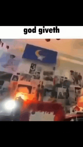 a blurry picture of a room with the words `` god giveth '' written on it