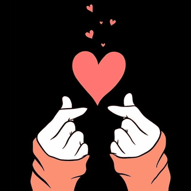 a pair of hands making a heart shape with their fingers