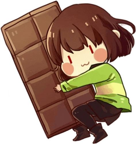 a girl in a green shirt is holding a giant chocolate bar