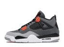 a pair of gray and orange air jordan 4 sneakers with a white sole on a white background .