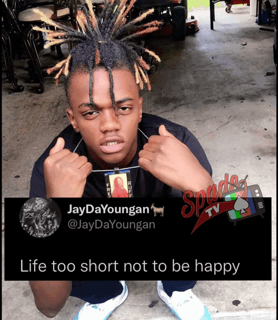 a picture of a young man with dreadlocks and a caption that says " life too short not to be happy "