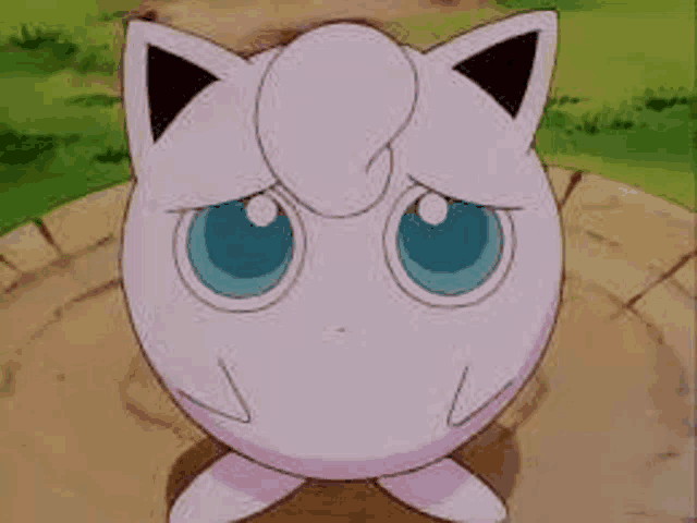 jigglypuff from pokemon is a pink cat with blue eyes .