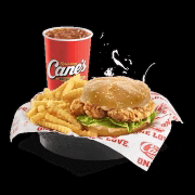 a chicken sandwich with fries and a cane 's soda