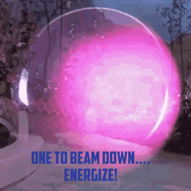 a pink sphere with the words one to beam down energize on it