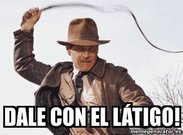 a man in a hat is holding a whip in his hand and saying `` dale con el latigo '' .