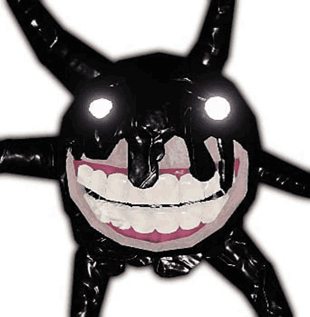 a close up of a monster with horns and a big smile .