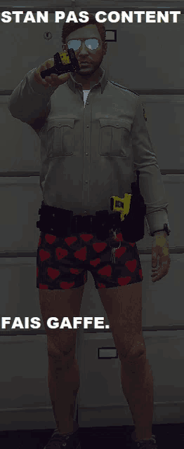 a man wearing shorts with hearts on them is holding a taser