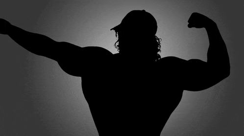 a silhouette of a man flexing his muscles wearing a baseball cap