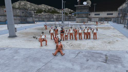 a group of prisoners are posing for a picture in front of a basketball court