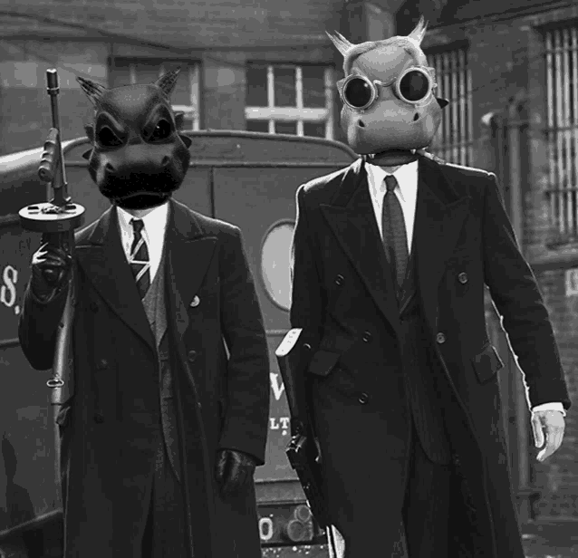 two men in suits and gas masks are standing next to each other in front of a van that has the letter v on it