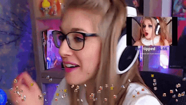 a woman wearing glasses and headphones looks at a screen that says " tipped " on it