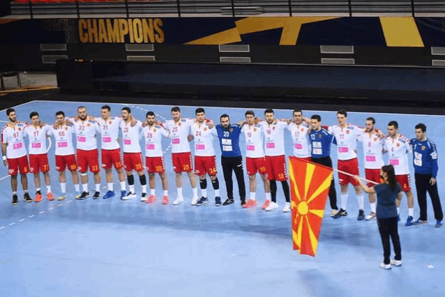 a group of athletes are standing in front of a sign that says champions