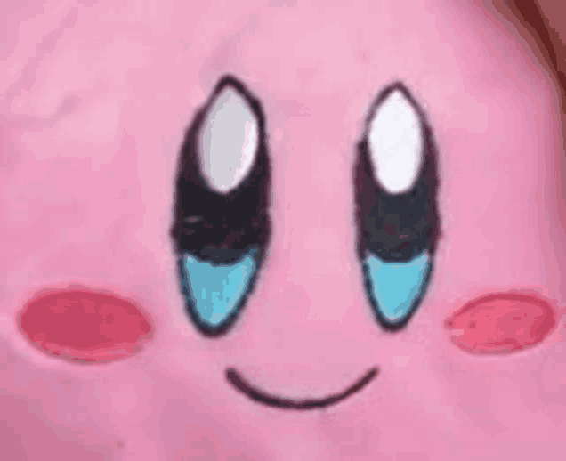 a close up of a pink kirby face with blue eyes and a smiling face .