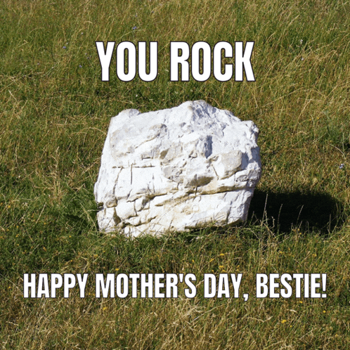 a white rock in the grass with the words you rock happy mother 's day bestie on it