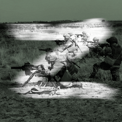 a black and white photo of soldiers in a field with a light shining on them