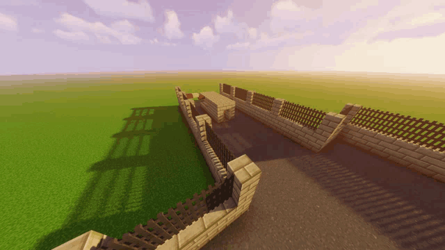 a brick wall with a wooden fence in a minecraft game