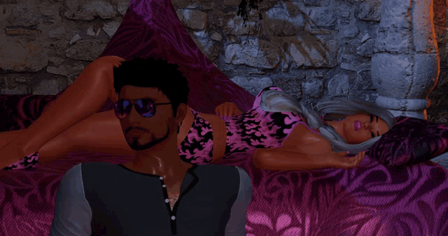 a man and a woman are laying on a purple bed