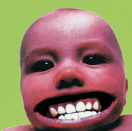 a close up of a baby 's face with a big mouth