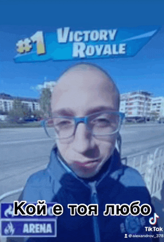 a bald man wearing glasses is standing in front of a victory royale sign