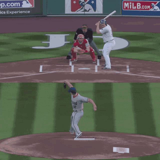 a baseball game is being played in front of a milb banner