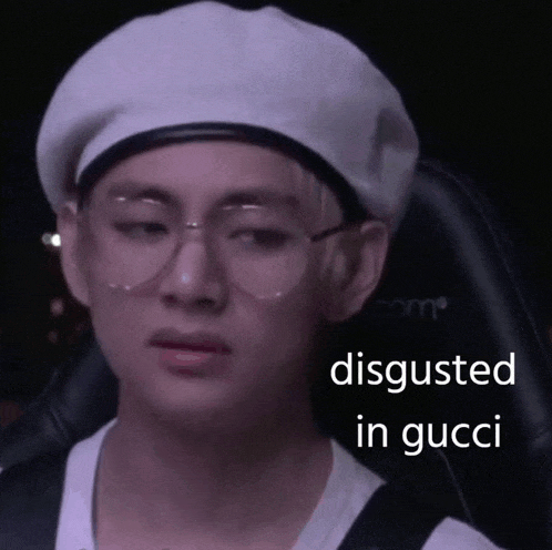 a man wearing glasses and a beret with the words disgusted in gucci