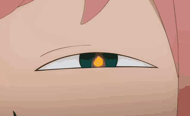 a close up of a cartoon character 's eye with a fire coming out of it